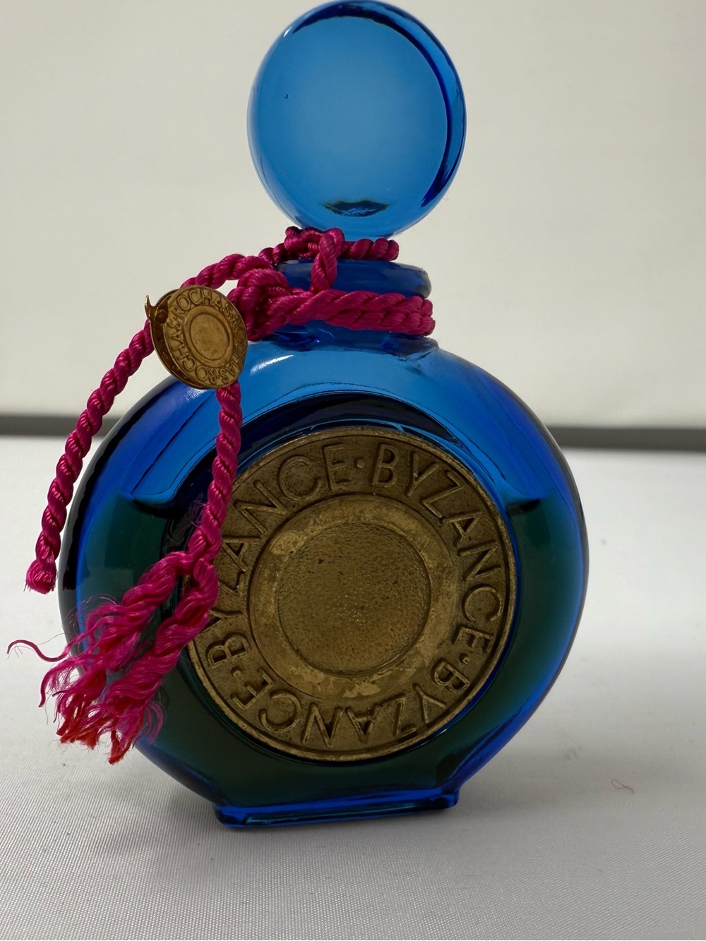 Vintage Parfum Rochas Blue Glass Decorative Bottle with Fuchsia Cord